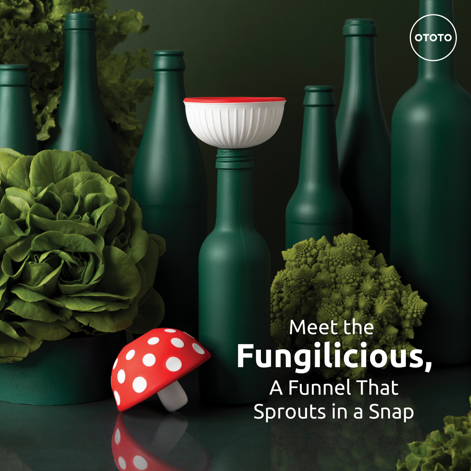 Green bottles with leafy greens and the OTOTO Fungilicious red mushroom foldable kitchen funnel.