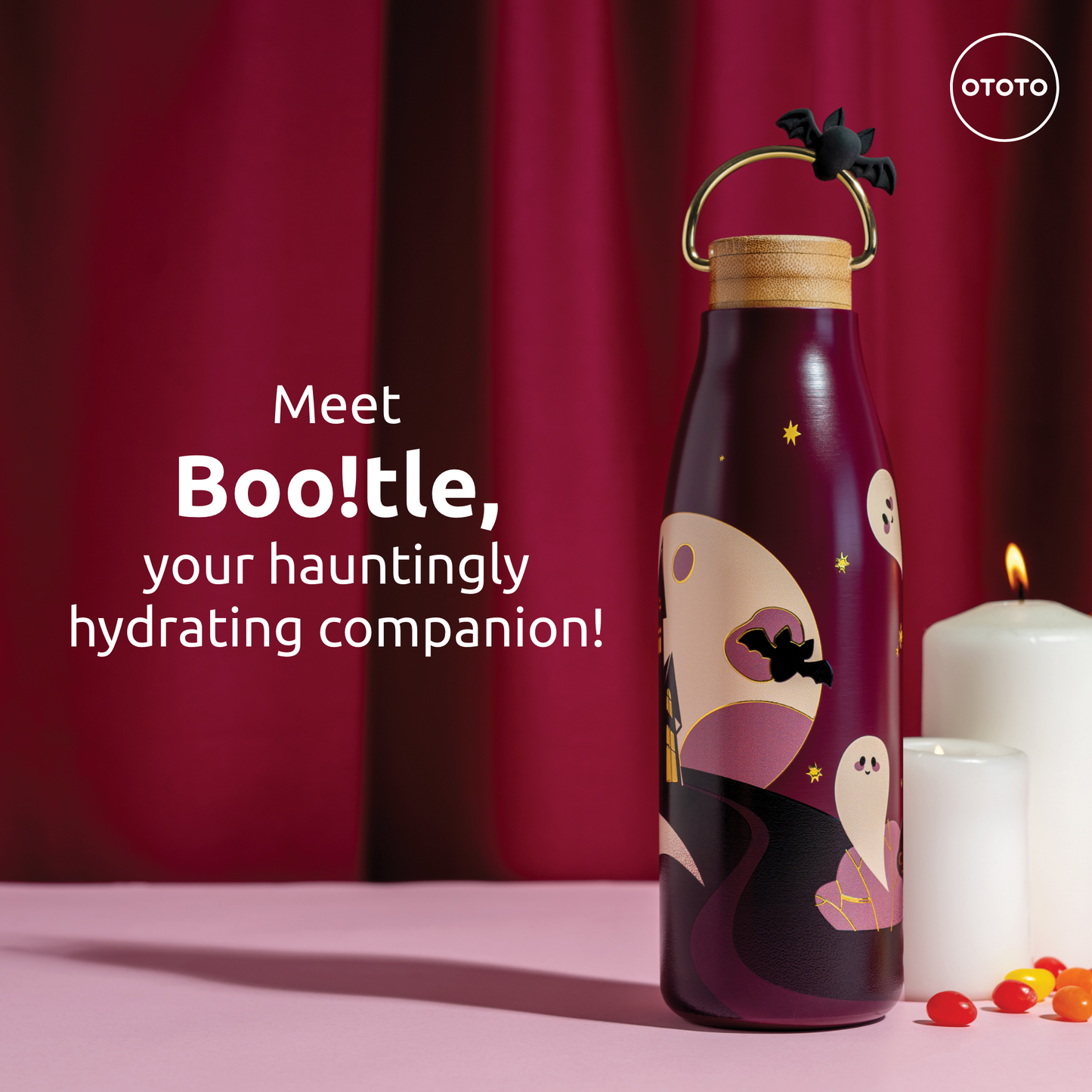 Meet Boo!tle—a purple OTOTO Halloween water bottle with ghosts, bats, candy, and a lit candle.