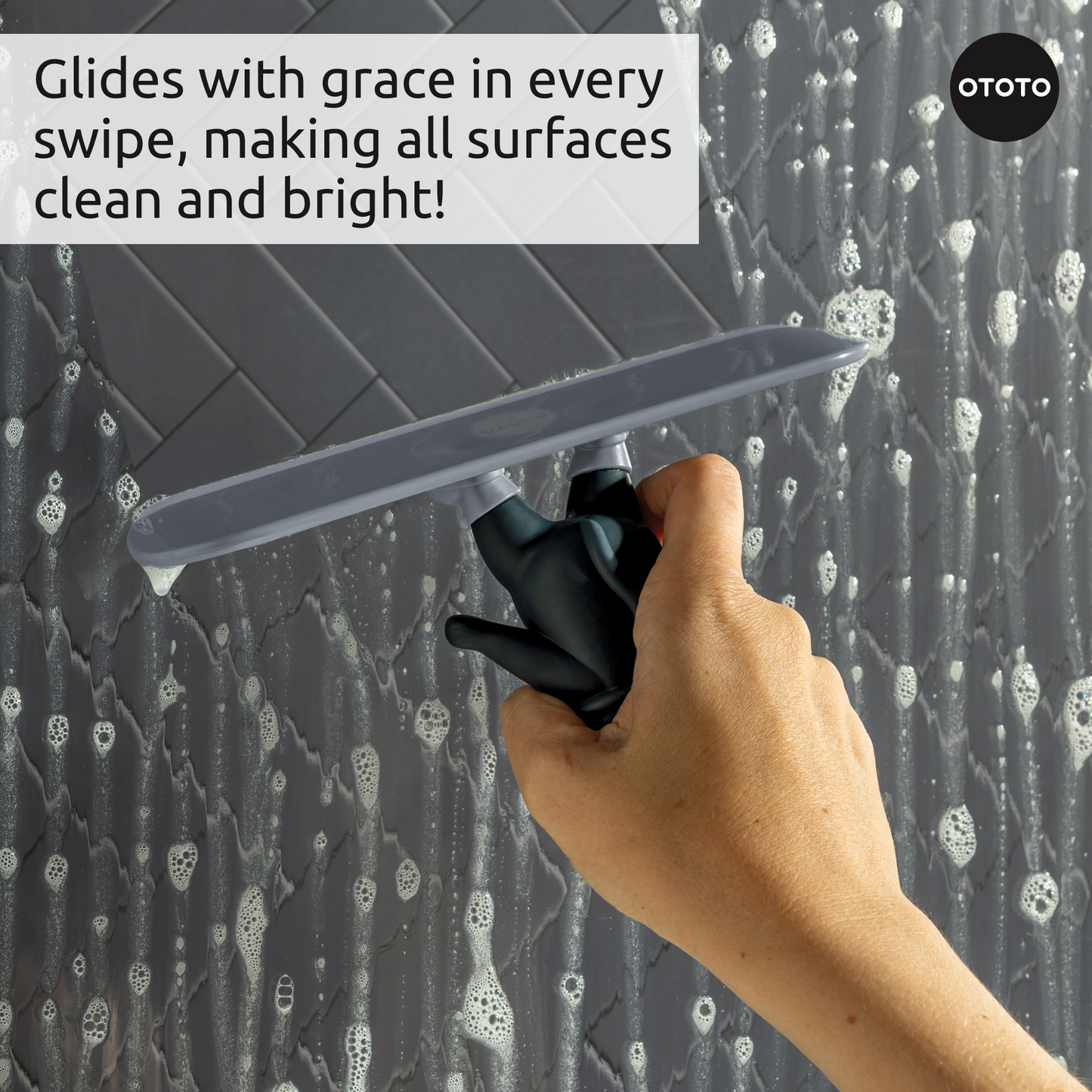 Hand using a Chill Cat on soapy tiles—glides smoothly for streak-free, spotless surfaces.
