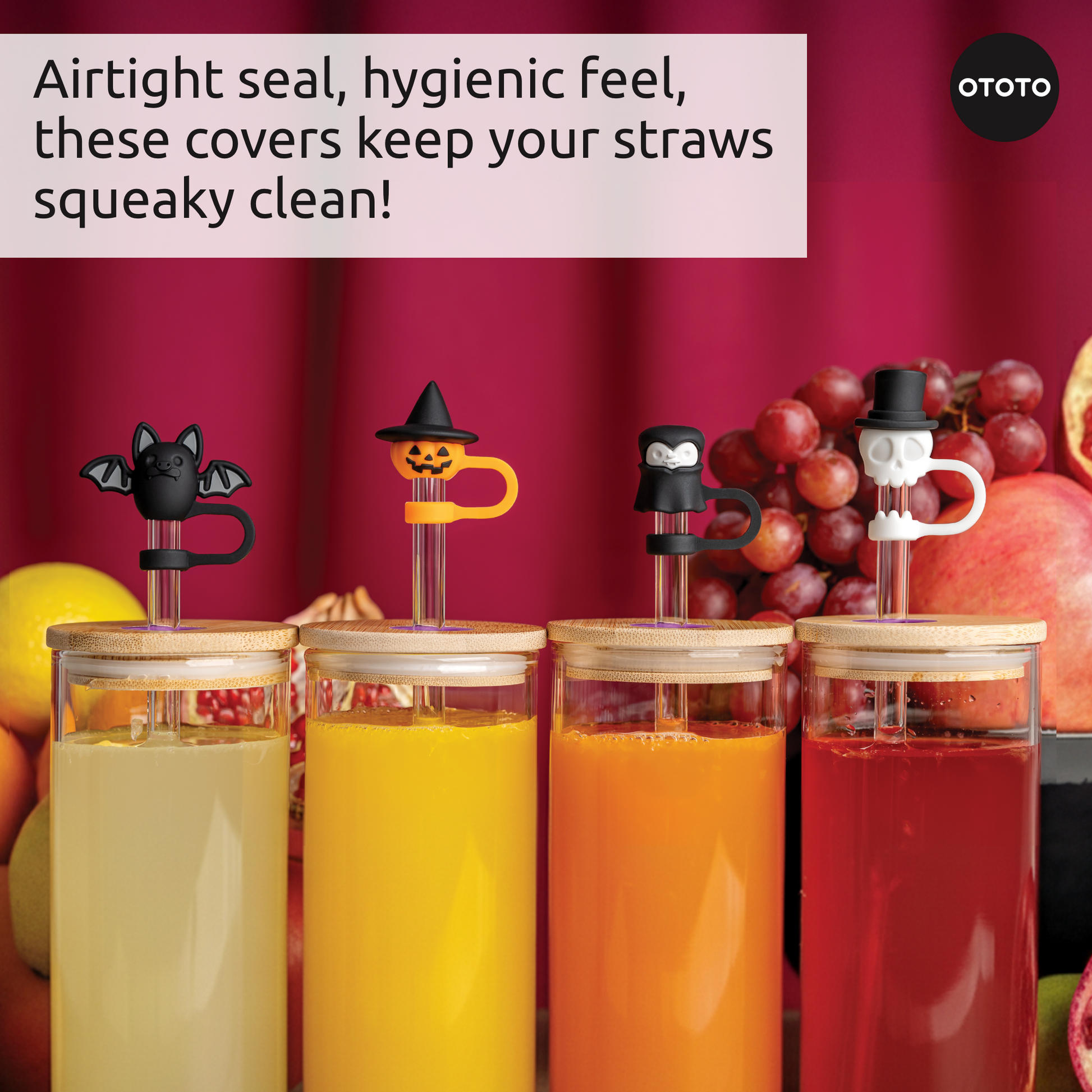 Four colorful drinks with Boo Team’s straw toppers: bat, pumpkin, penguin, and skull designs.