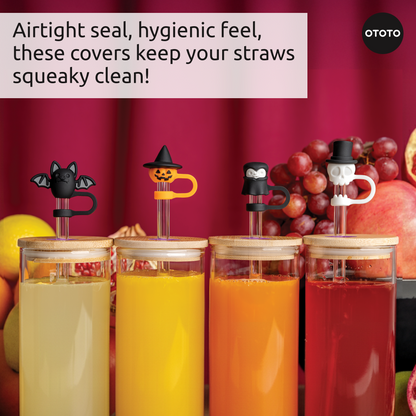 Four colorful drinks with Boo Team’s straw toppers: bat, pumpkin, penguin, and skull designs.