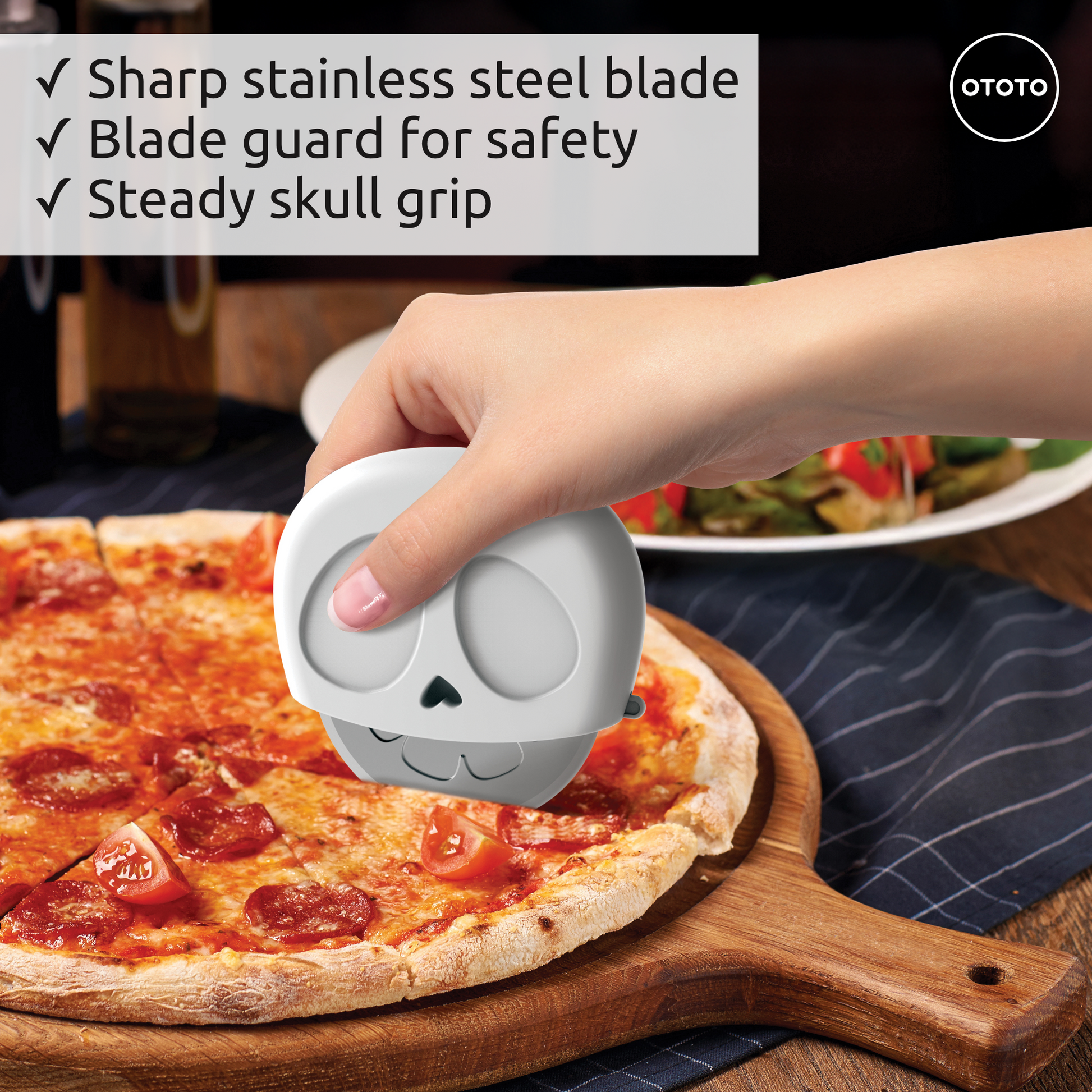 A hand uses the Slice Reaper pizza cutter on pepperoni pizza; text lists product features.