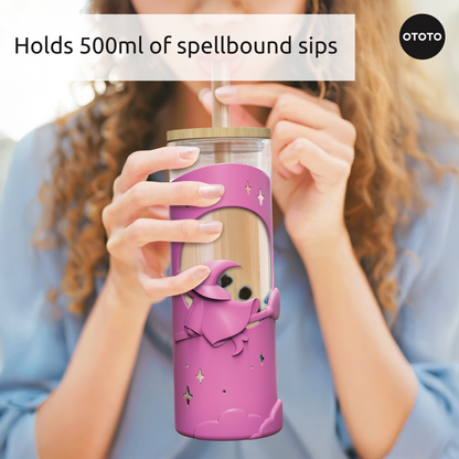 Woman sipping from a 500ml OTOTO Wicked Brew cup featuring a cute pink wizard, clear lid, and straw.