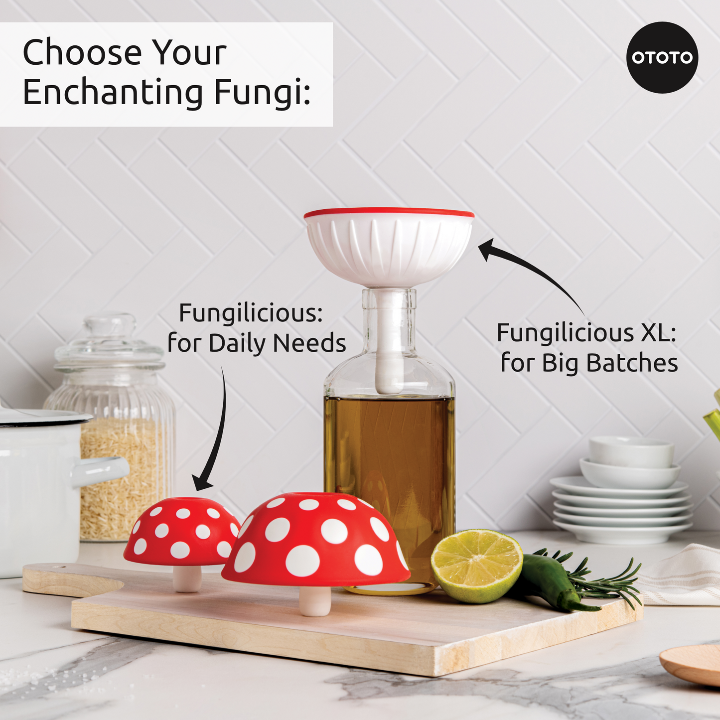 Two red-and-white OTOTO Fungilicious foldable kitchen funnels sit near a bottle and chopped lime.