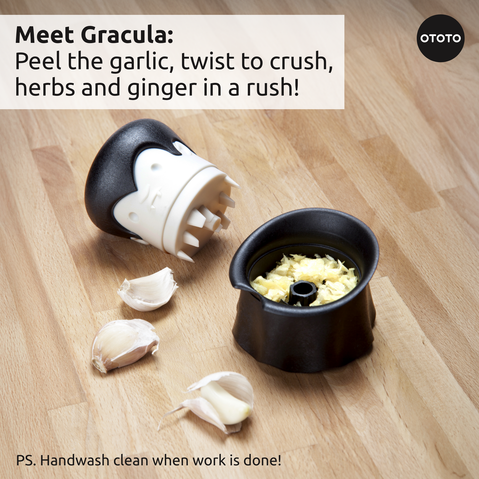 The Boo-tiful Crew garlic crusher by OTOTO looks like Dracula, shown on a wooden surface.