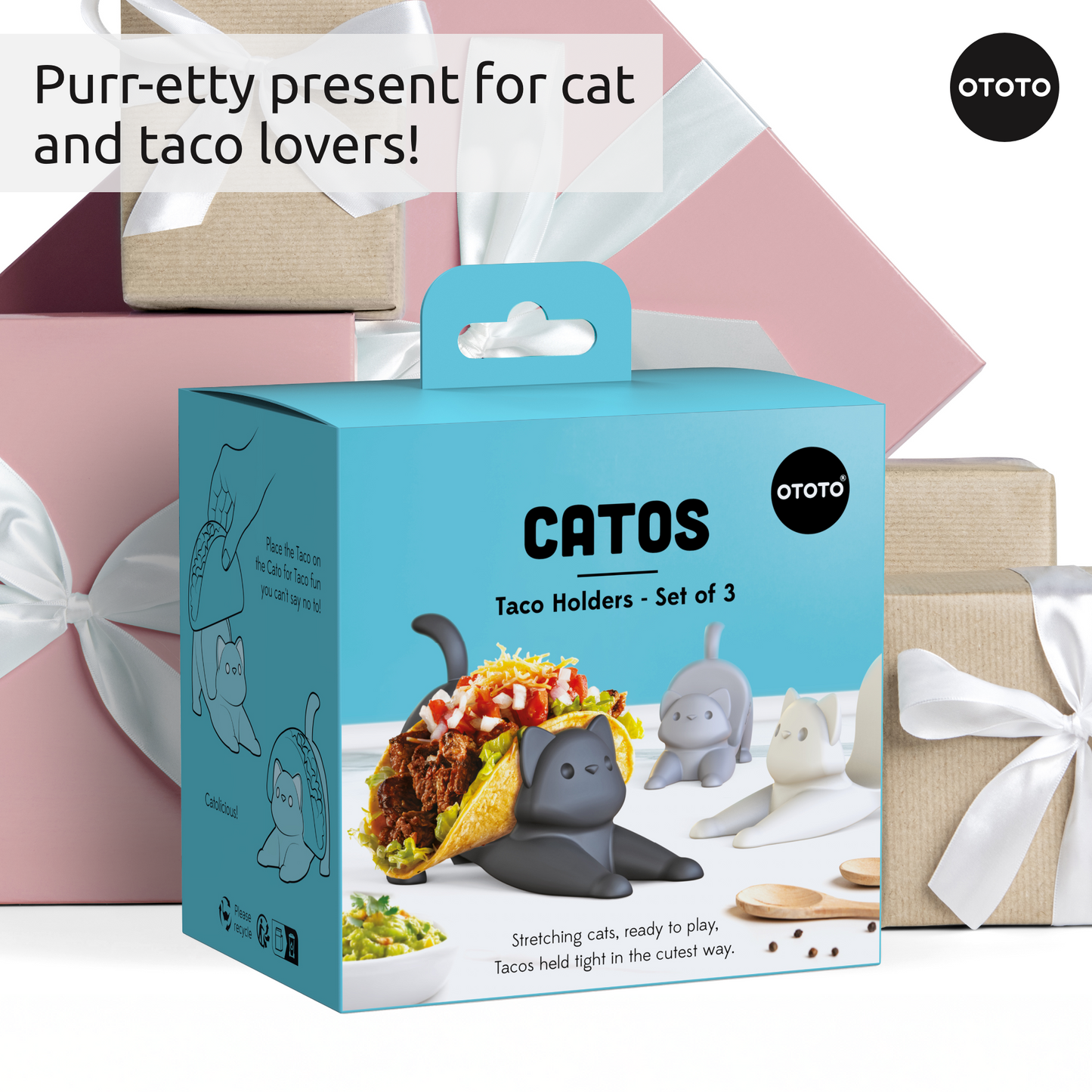 Catos OTOTO cat taco holders displayed in front of pastel and brown gift-wrapped boxes.