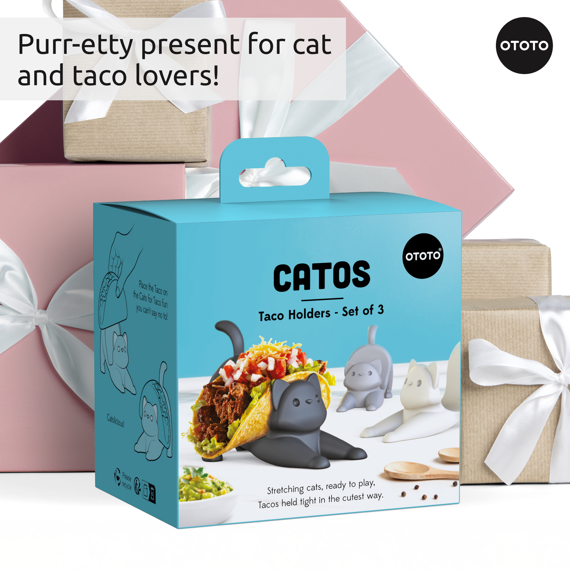 Catos OTOTO cat taco holders displayed in front of pastel and brown gift-wrapped boxes.
