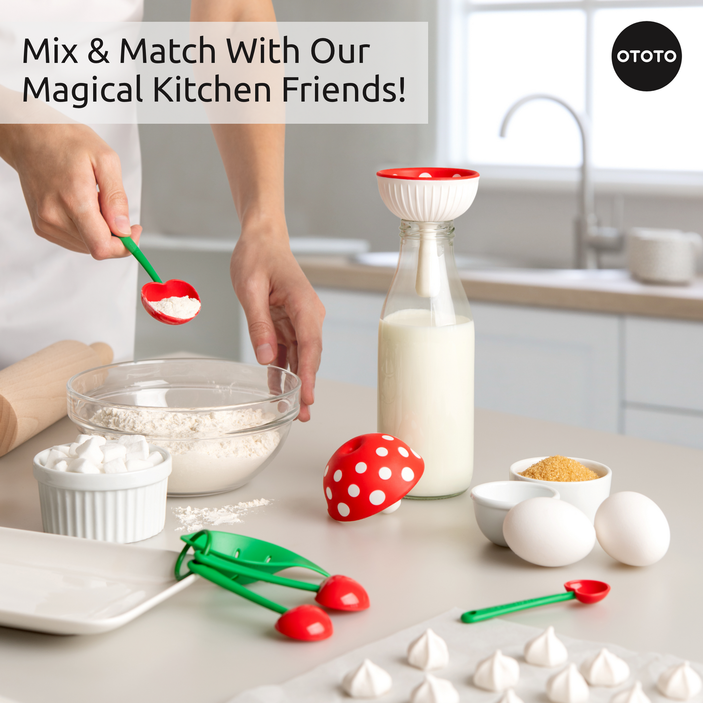 A person measures flour near the Fungilicious kitchen gadget, OTOTO tools, eggs, and a milk bottle.