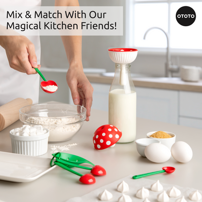 A person measures flour near the Fungilicious kitchen gadget, OTOTO tools, eggs, and a milk bottle.