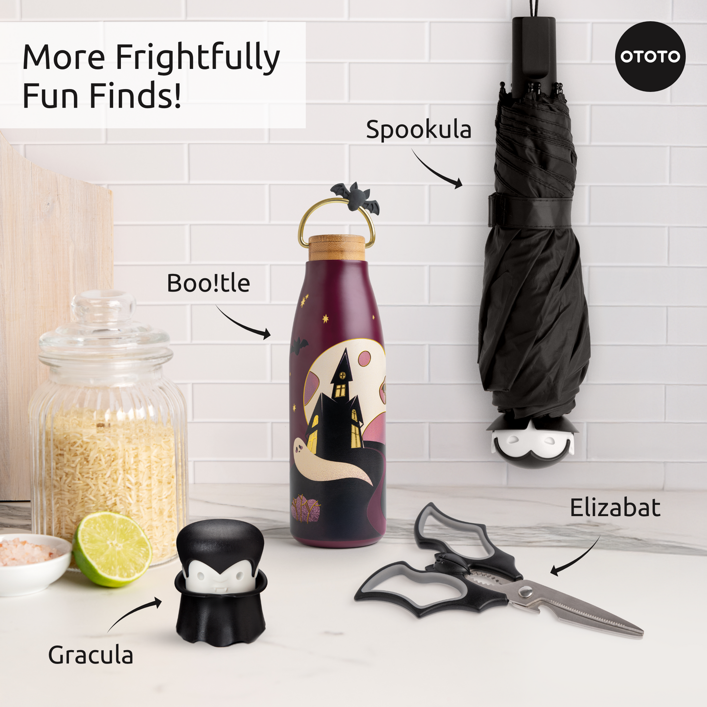 A Halloween kitchen with bat scissors, OTOTO vampire bottle stopper, and Boo!tle ghost bottle.