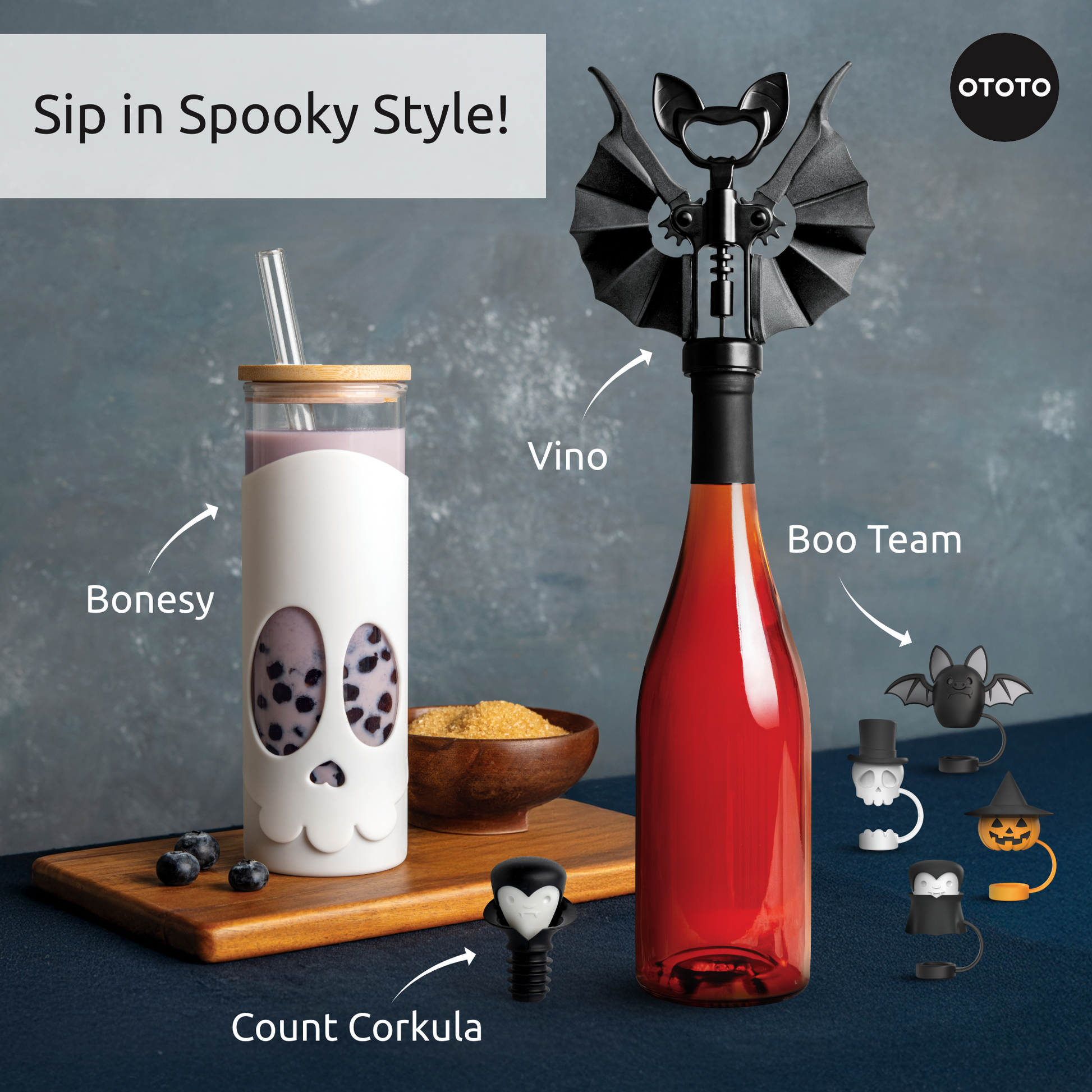 A spooky Boo Team drink with Halloween straw toppers featuring cute bat, skull, and ghost accents.