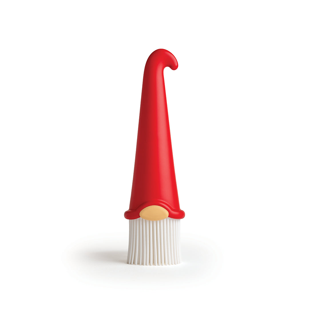 Gnomeo pastry brush by OTOTO features a handle shaped like a red gnome hat and a yellow nose.