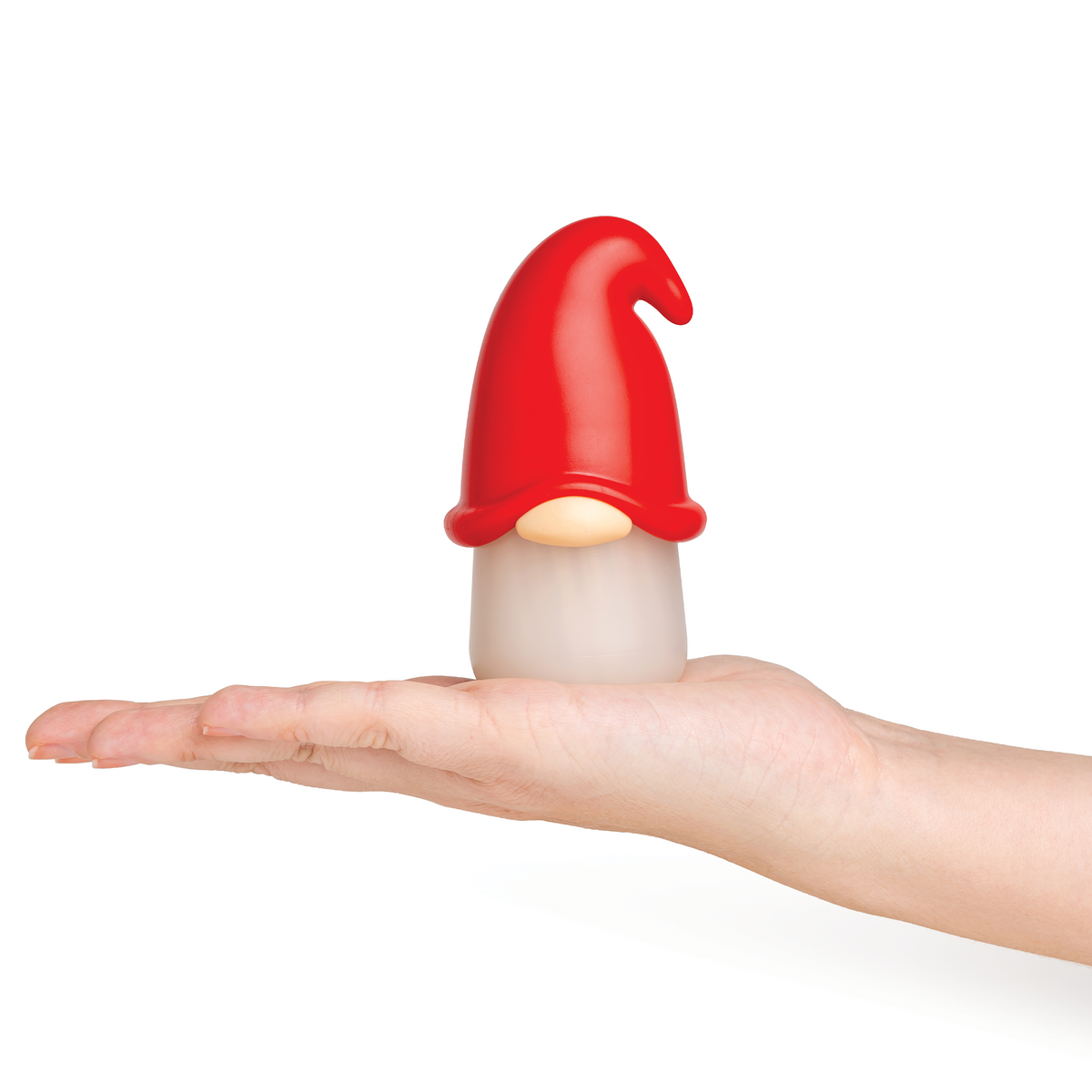 A hand holds the Gnomeo figurine: a whimsical, red-hatted gnome with no visible face on white.