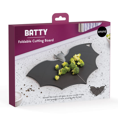 Batty bat-shaped chopping board with broccoli, perfect for a spooky-cute kitchen by OTOTO.