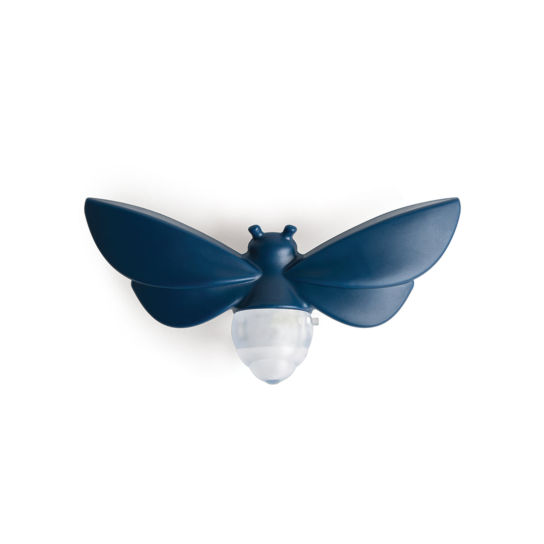 Lightbug: A blue and white bee-shaped wall lamp with large wings on a plain white background.