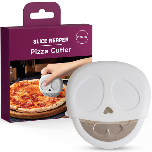 Slice Reaper pizza cutter by OTOTO, skull-shaped, shown in use with original box.