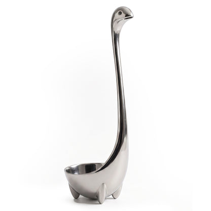 Metal Nessie: OTOTO’s stainless steel dinosaur ladle with a long neck and feet, displayed on white.