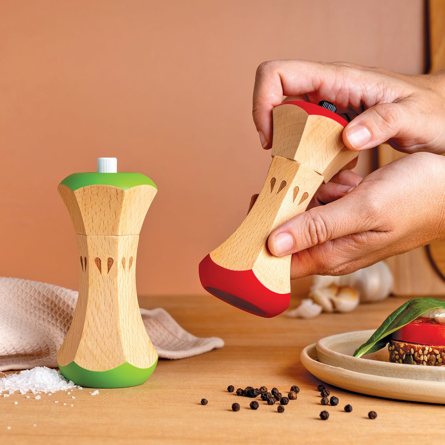 Twin Spice manual wooden grinders, with apple core design, bring charm to your kitchen spice setup.