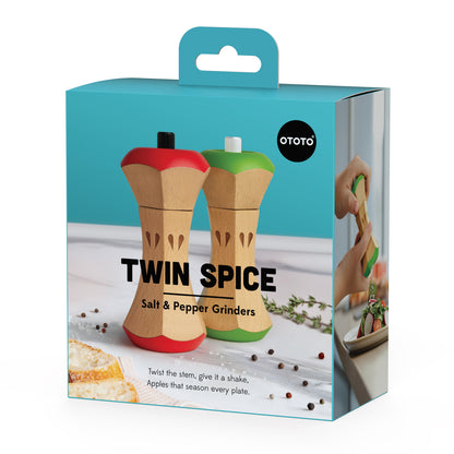 Box showing Twin Spice manual salt and pepper grinders shaped like apples in a kitchen.