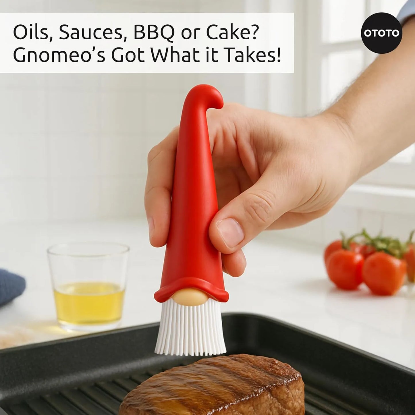 A hand spreads sauce on steak with the OTOTO Gnomeo gnome-shaped pastry brush in the kitchen.