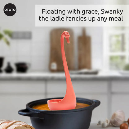 Swanky, a pink swan-shaped ladle, floats gracefully in a pot of soup.